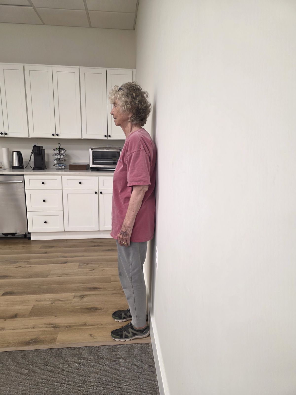 Posture exercise against the wall